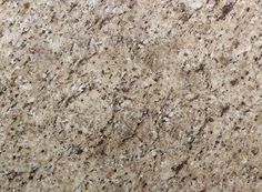 a close up view of a granite countertop with brown and white speckles