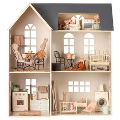 a doll house with furniture and accessories in it