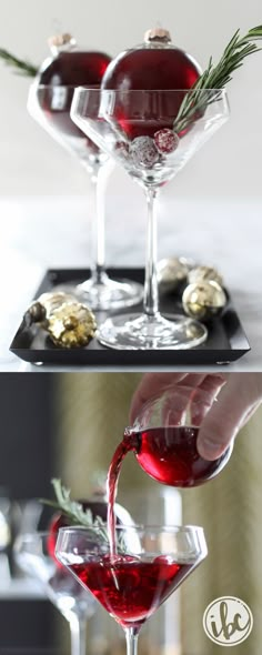 someone pouring red wine into a martini glass with rosemary sprigs on top and another shot in the background