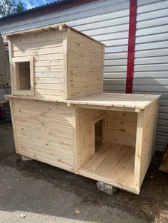 a small wooden house sitting on top of a pallet