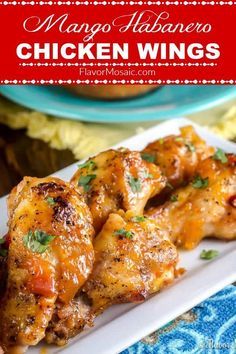 chicken wings on a plate with sauce and parsley