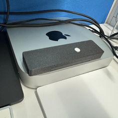 an apple laptop computer sitting on top of a desk