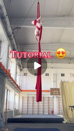 the aerial acrobatic pole is suspended upside down in an indoor gym area