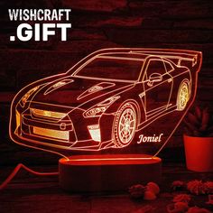 a car shaped lamp with the words, wishcraft gift on it and an image of a