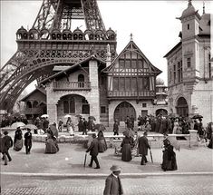 an old black and white photo of people in front of the eiffel tower