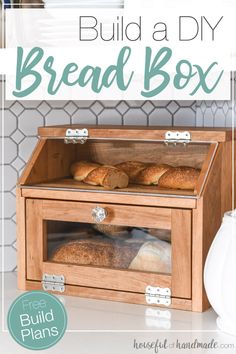 a wooden box with bread in it and the words build a diy bread box