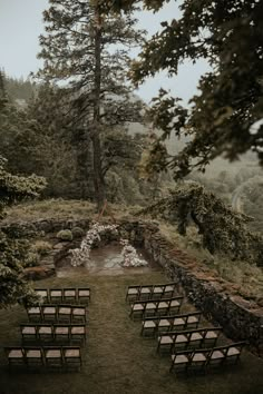 an outdoor ceremony set up in the woods