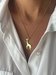 🦒Great gift for tall people🦒 Get this cute jewelry made with the high quality elements✨ You can go with 925K Sterling Silver with the options of Gold, Rose Gold or White Gold finish Beautiful jewelry for everyone 💙 Details * 925K Sterling Silver → 14K Gold, Rose Gold or White Gold plated * Chain length is approximately either 18 inches  / 45 cm or 22 inches / 55 cm 18 inches (16+2 in extender) / 45 cm (40+5 cm extender) 22 inches (20+2 in extender) / 55 cm (50+5 cm extender) * Time is important! You will receive your package as soon as possible 🚚 * We care about the quality of metal to make sure it will last for a long time * We use enamel technique to color the jewelry and high quality zircons only * There can be tiny differences on each item, length difference of the chain as well as Gold Animal Design Necklace For Gift, Giraffe Necklace, Animal Necklace, Tall People, Unisex Necklace, Minimalist Gifts, Necklace Minimalist, Handcrafted Necklace, Pet Necklace