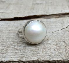 Large Elegant White Cream Luminescent Mabe South Sea AAA Pearl  Sterling Silver Ring | Mermaid Jewel Classic White Pearl Ring With Charm, Classic White Pearl Ring With Pearl Charm, White Oval Pearl Ring, White Pearl Drop Ring, White Oval Cabochon Pearl Ring, White Oval Pearl Ring With Cabochon, Handmade White Oval Pearl Ring, White Oval Pearl Drop Rings, White Pearl Ring With Pearl Charm