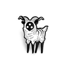 a black and white pin with a goat on it's back side, in front of a white background