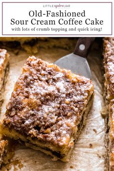 a piece of cake sitting on top of a wooden cutting board next to a knife