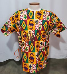 Round Neck Dashiki shirt Short Sleeves Tailored Dashiki shirt made with very Quality Dashiki Fabric.  Ready To Ship CARE INSTRUCTIONS:  Dry Clean Recommended DO NOT BLEACH Press with warm iron on the wrong side ALL SALES ARE FINAL Traditional Multicolor Printed Shirt, Red Cotton Short Sleeve Kaftan, Traditional Short Sleeve Batik Print Kaftan, Casual Multicolor Short Sleeve Kaftan, Traditional Short Sleeve Kaftan With Batik Print, Fitted Multicolor Short Sleeve Kaftan, Traditional Fitted Kaftan With Short Sleeves, Casual Short Sleeve Batik Kaftan, Casual Short Sleeve Batik Print Kaftan