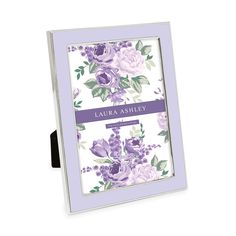 a purple and white frame with flowers on it