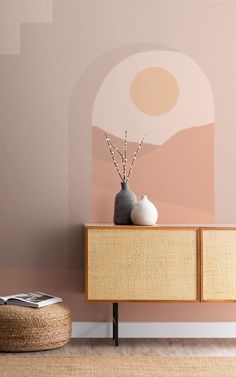 two vases sitting on top of a wooden cabinet in front of a pink wall