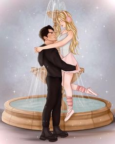 a man and woman hugging in front of a fountain with stars on the wall behind them