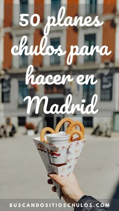 a person holding a cup with pretzels in it and the words 50 planos para hacer en madrid