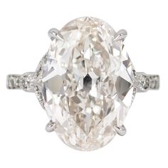 This romantic, antique inspired engagement ring by J. Birnbach features a gorgeous 8.56 carat oval diamond. The center diamond is GIA certified as J color and SI1 clarity. The platinum setting features milgrain and pave details create a feminine, antique look. The ring is crafted to sit perfectly with any band, and the pave diamonds total 0.29 carats. Customization and sizing available. Antique Style Engagement Rings, Antique Style Rings, Expensive Jewelry Luxury, Oval Cut Engagement Ring, Future Engagement Rings, Rings Engagement, Expensive Jewelry, Oval Cut Diamond, Shiny Things