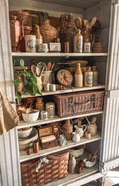 an old cupboard filled with lots of different types of kitchen utensils and other items