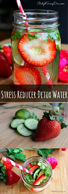 a jar filled with sliced strawberries and cucumbers next to another jar full of water