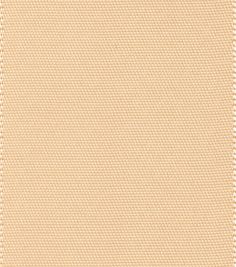 a beige background with white stitching on it