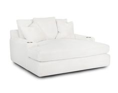 a white couch with pillows on it and a pillow in the back ground, sitting against a white background