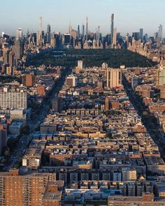 an aerial view of a city with lots of tall buildings