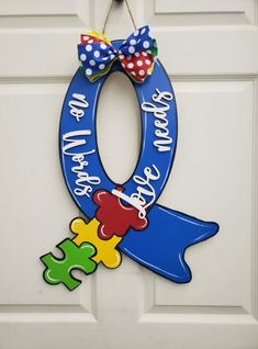 a door hanger with a puzzle piece on it