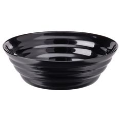 a black bowl sitting on top of a white table