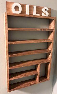 "Custom Wood Essential Oils Shelf Handmade, my husband hand makes each and every one! dim. are 29\"tall x 17\" wide 3\" depth The openings are 3.5\"tall & the larger area is 7.5\"tall Please choose your shelf color and your letters color at checkout Custom orders upon request. Satisfaction guaranteed! Thanks for looking" Essential Oils Display, Dispensary Ideas, Essential Oils Shelf, Shack Interior, Essential Oil Display, Essential Oil Rack, Oil Display, Easy Diy Home Projects, Oil Rack