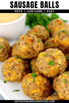 a white plate topped with meatballs and garnished with parsley