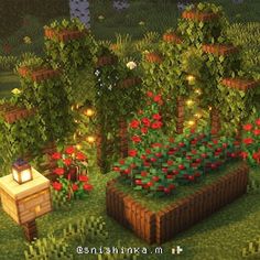 an image of a garden with flowers and lights in the night time, as well as a bench made out of blocks