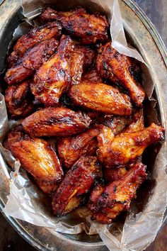 some chicken wings in a bowl on a table