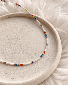 💖 Looking for the perfect Christmas gift for your teenage daughter? Look no further than this rainbow boho beaded choker!  Handmade with love, this multicolor seed bead necklace is surely to impress * MATERIALS * It is made of high quality Czech seed beads This choker has adjustable stainless steel chain with lobster claw closure 📐 MEASUREMENTS * Choker thickness: 0.08 inch or 2 mm You can choose any length you need Care instructions ➖ keep away from moisture ➖ avoid contact with lotion, perfu Bohemian Rainbow Jewelry With Letter Beads, Bohemian Letter Beads Choker Gift, Handmade Rainbow Beaded Choker Necklaces, Handmade Rainbow Choker Beaded Necklaces, Rainbow Heishi Beads Necklace, Handmade Rainbow Beaded Choker Necklace, Rainbow Colorful Beads Choker, Adjustable Rainbow Beaded Choker Necklaces, Adjustable Rainbow Beaded Choker