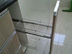 a metal rack in the corner of a kitchen