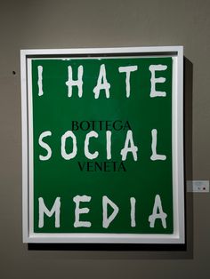 a green and white sign that says i hate rottega social media on it