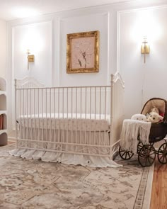 a white crib with a teddy bear in it