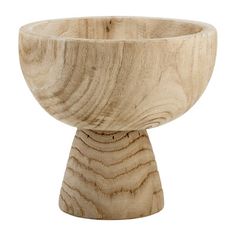 a wooden bowl sitting on top of a table