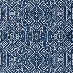 a blue and white rug with an abstract design