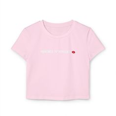 Stay cute and confident in this "Short N' Sweet" baby tee, inspired by Sabrina Carpenter's effortlessly chic vibe! Perfect for fans or anyone who loves a flirty, fun style. With its soft fabric and flattering fit, this tee is your go-to for casual days, concerts, or a laid-back night out. This women's baby tee is designed with a slim fit and mid-length cut, offering a flattering silhouette. Made from 100% organic cotton rib, it provides both comfort and sustainability, making it a versatile and stylish choice for everyday wear. * 100% organic cotton * Slim fit Cute Fitted Tops With Logo Print, Cute Unisex Slogan Tops, Unisex Pink Top With Funny Print, Unisex Pink Summer Tops, Cute Fitted Pre-shrunk T-shirt, Cute Fitted T-shirt With Text Print, Cute Pink Crop Top With Text Print, Pink Unisex Tops For Spring, Pink Short Sleeve Crop Top With Text Print