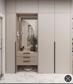 an image of a bathroom setting with marble flooring and cabinets in it's corner