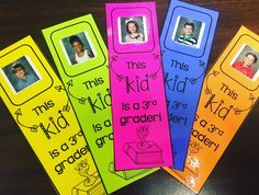 four bookmarks with pictures of children's faces and words on them sitting on a table