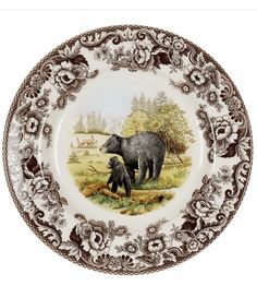 a plate with an elephant and cub on it