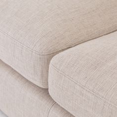 the back end of a beige couch