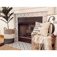 a living room with a fire place and rugs on the floor next to it