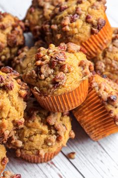 some muffins are sitting on a table with the words, these simple sweet potato muffins are most with a tender crumb