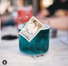 a blue drink sitting on top of a table