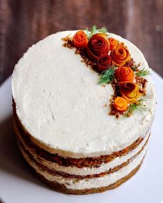 a white cake with flowers on top is shown in the instagramt for an article