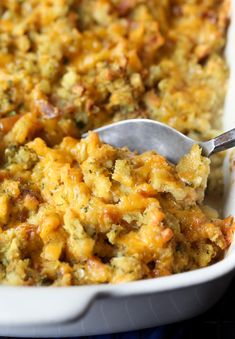 a casserole dish with a spoon in it