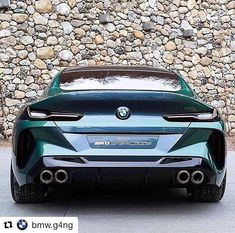 the rear end of a green bmw concept car