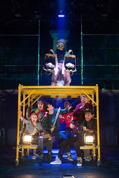 a group of people standing on top of a stage